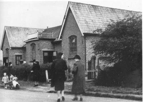 People walking past the original South Woodham Ferrers Village Hall